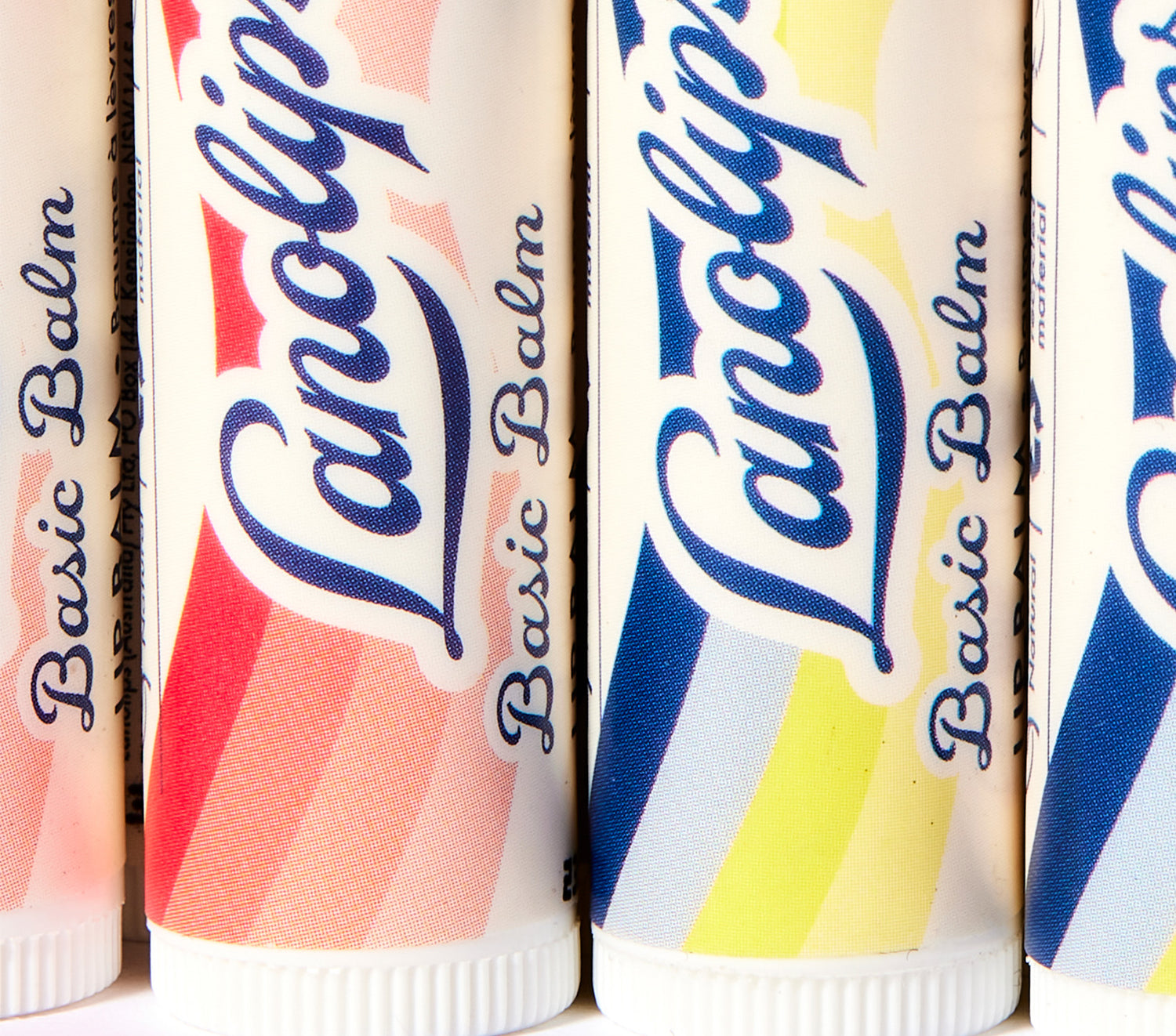 Lanolips basic balm vanilla, strawberry and coconut flavours close up shot
