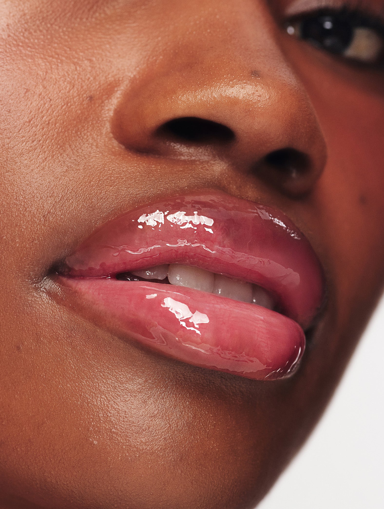 Lanolips Mocha Choca Ceramide Milkshake Balm on lips, hydrating tinted lip balm with glossy finish on deep skin tone