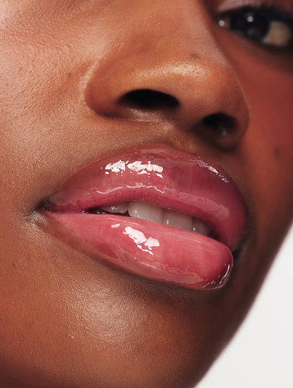 Lanolips Mocha Choca Ceramide Milkshake Balm on lips, hydrating tinted lip balm with glossy finish on deep skin tone